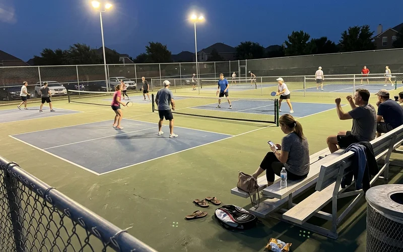 Evening league play on the finished lit Frisco pickleball complex