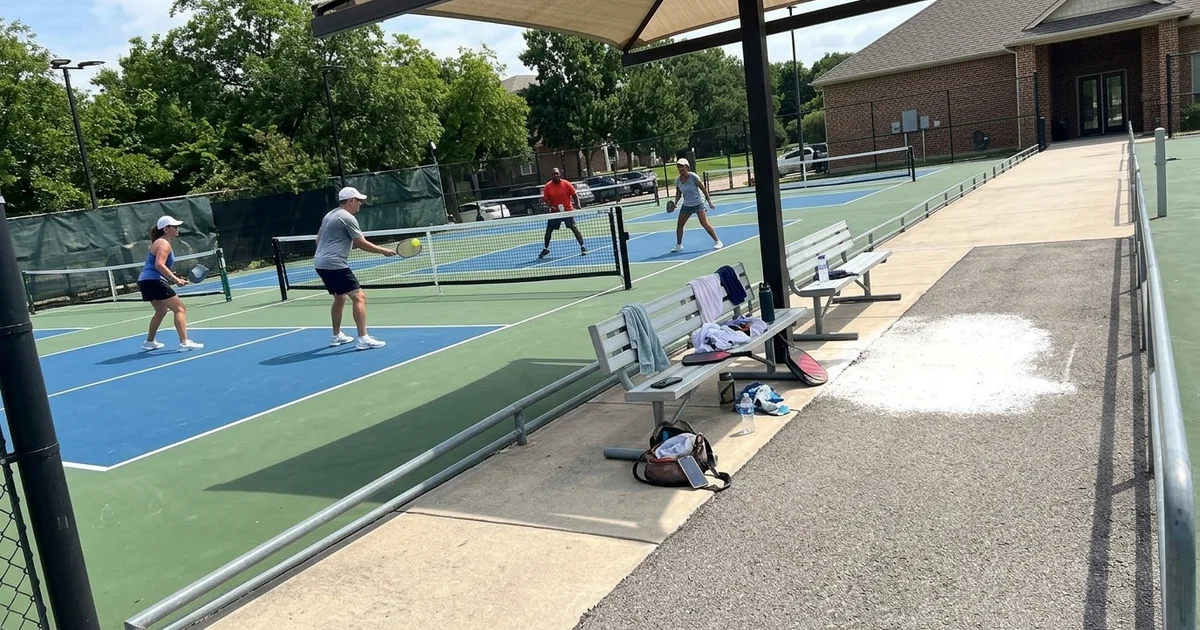 Community pickleball courts in use at a Texas HOA amenity centre