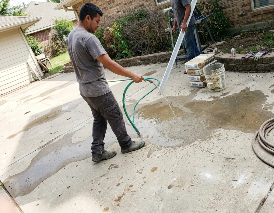 Flood-testing a court surface to locate birdbath low spots